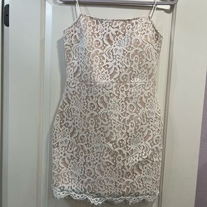 Beige undertone with white lace dress. Never worn before but does not have tags